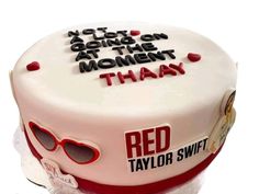 a red taylor swift birthday cake with sunglasses on the top and words that read, it's not going down at the moment