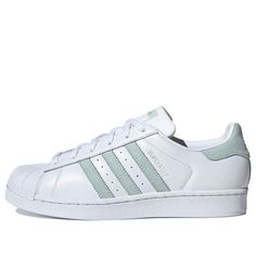 (WMNS) adidas Superstar 'White Vapour Green' EE7401 (SNKR/Women's) Adidas White Sneakers With Three Stripes, Adidas White Sneakers With Logo, White Three Stripes Sneakers, White Lace-up Sneakers With Three Stripes, White Synthetic Sneakers With Three Stripes, White Low-top Sneakers With Three Stripes, White Adidas Sneakers For Spring, Adidas White Athletic Fit Sneakers, White Sneakers With Three Stripes Branding For Athleisure