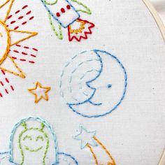 an embroidery project with space and stars on it