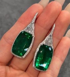 DropDangle Engagement Earring, Halo Wedding Earring, Green Emerald Gemstone Earring, Trilliant & Emerald Cut Diamond Earring, Silver Earring   Item Description: Stone - Simulated Diamond Shape- Trilliant & Emerald Cut 1. White Gold: 10K/14K/18K 2. Yellow Gold: 10K/14K/18K 3. Rose Gold: 10K/14K/18K 4. Silver: Sterling Silver 925 Size Customization: What Size you want... * You can also Customize ring size in US 4 to US 12! It sometimes affects to price. * Main Stone & Shape Customization: Main Stone: Cubic Zirconia, Moissanite, Natural Diamond, CVD Diamond Shape Choice: Round Cut, Heart, Princess Cut, Pear Cut, Cushion Cut, Marquise, Oval Shape, Asscher, Emerald, Radiant, Old European Cut, Old Mine Cut * Check out Special Notes: At checkout, leave us a note in the message box for the Ring si Emerald Drop Diamond Earrings For Wedding, Exquisite Green Earrings With Prong Setting, Exquisite Emerald Drop Earrings, Elegant Gia Certified Emerald Earrings, Gia Certified Emerald Earrings For Wedding, Gia Certified Emerald Wedding Earrings, Elegant Emerald Cut Emerald Earrings, Elegant Single Emerald Earring, Emerald Cut Fine Jewelry Earrings For Wedding