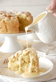 a piece of cake is being drizzled with icing on a plate