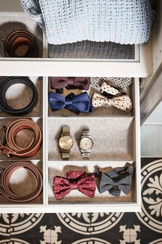 several different types of bow ties in a drawer