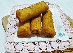 some food is on a white doily on a table