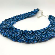 "Features: * Beautiful necklace * Seed beads * Blue and navy color * Item# U23092 Size: 16\" length Condition: Pre-Owned Good Gently Loved...  Thank you for visiting our shop!" Blue Beaded Chain Bib Necklace With Round Beads, Blue Adjustable Bib Necklace With Round Beads, Blue Beaded Chain Bib Necklaces, Blue Bib Necklace With Beaded Chain And Round Beads, Blue Round Beaded Chain Bib Necklace, Adjustable Blue Bib Necklace With Round Beads, Adjustable Blue Bib Necklace With Colorful Beads, Blue Beaded Bib Necklace With Round Beads, Blue Beaded Chain Choker