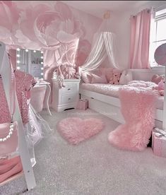 a bedroom decorated in pink and white with flowers on the walls, bedding and rugs