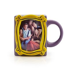 a purple and yellow coffee mug with an image of the cast of friends on it