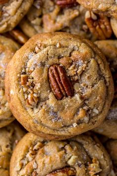 several cookies with pecans in the middle