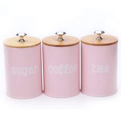 three pink canisters with the word sugar on them