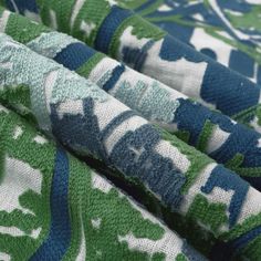 the fabric is green, white and blue