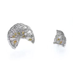 Cast directly from dried lemon slices, these silver and yellow earrings make the freshest statement piece. Each piece is made exclusively by hand, and will therefore have its own unique characteristics. Treat your earrings with care. Silver, Yellow Cubic Zirconia, 18K Gold Earring Posts Dried Lemon Slices, Lemon Earrings, Dried Lemon, Lemon Slices, 18k Gold Earrings, Lemon Slice, Yellow Earrings, Earring Posts, Gold Earring