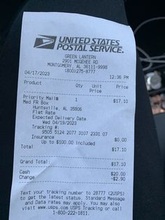 a united states postal service receipt sitting on the back of a car's seat