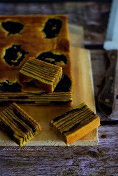 there are several pieces of food on the cutting board