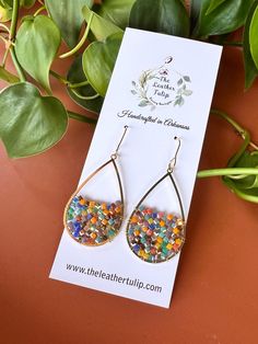 Multi-Color Beaded Teardrop Earrings feature a vibrant array of hues.  Perfect for adding a splash of color to any outfit.  These earrings are lightweight and comfortable for all-day wear.  Ear wires are gold plated stainless steel. DROP LENGTH:  2 1/8" WIDTH:  1" Thank you for Shopping The Leather Tulip.  I appreciate your support! https://instagram.com/theleathertulipboutique Multicolor Teardrop Earrings For Gift, Multicolor Hypoallergenic Teardrop Earrings, Hypoallergenic Multicolor Teardrop Earrings, Multicolor Nickel-free Teardrop Earrings For Gifts, Multicolor Teardrop Jewelry For Crafting, Multicolor Hypoallergenic Teardrop Earrings As Gift, Multicolor Beaded Teardrop Earrings For Gift, Handmade Multicolor Drop Teardrop Earrings, Handmade Multicolor Teardrop Drop Earrings