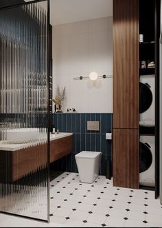 a bathroom with a toilet, sink and washer dryer inside of it's walls