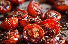 sliced tomatoes on a cutting board ready to be cooked