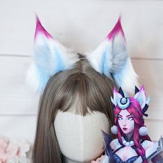 Our handmade Snow Moon Ahri ears give your cosplay the final touch. It is also lightweight and does not press on the head. ♡ Luxury long pile faux fur in white and light blue (inside) ♡ Airbrushed blue and pink ♡ Size: approx. 7 x 13.5 cm long ♡ 3 mm wide silver color metal hair hoop ♡ The ears can be bent through the wire inside ♡ Handmade with love ▬ Please note that due to variations among computer monitors, actual colors may vary slightly from what appears on your screen. If you've got any q Ahri Cosplay, Snow Moon, Fox Ears, Hair Hoop, Metal Hair, Hair Hoops, Final Touch, Metallic Hair, White Fox