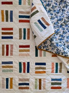 two quilts are laying on top of each other