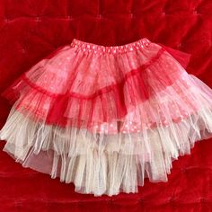 This Is Such A Cool And Beautiful Skirt. It Is A Red And Ivory Color, Tulle Layers That Are Longer On The Back Than Front. Excellent Condition, New With Tag. Girl Size 2, By Paper Wings. I’m A Single Mom, And Use My Sales To Help Offset My Daughter’s Growing Needs. I Consider Reasonable Offers And Offer Discount On Multiple Items. No Low-Ball Offers Please Winged Girl, Paper Wings, Layer Skirt, Beautiful Skirt, Layered Skirt, Beautiful Skirts, Single Mom, Ivory Color, Kids Bottoms