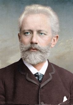 an old photograph of a man with a long white beard and wearing a brown jacket