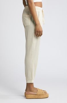 Softly crinkled and gently tapered, these gauzy cotton pants are the wearable equivalent of a day spent lounging on the beach. 28" inseam; 10 1/2" front rise; 14 1/2" back rise Elastic/drawstring waist Front slant pockets; back patch pockets 100% cotton Machine wash, dry flat Imported BP. Spring Cotton Bottoms With Crinkle Texture, Summer Loungewear Bottoms With Crinkle Texture, Summer Loungewear Pants With Crinkle Texture, Casual Summer Pants With Crinkle Texture, Casual Bottoms With Crinkle Texture For Spring, Surf Pants, Fabric Gift Bags, Back Patch, Rip Curl