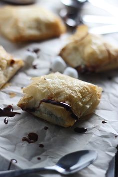 some kind of pastry that is sitting on wax paper