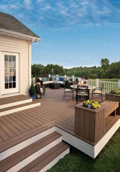 a deck with chairs and tables on it