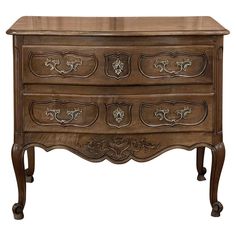 an old wooden dresser with drawers and carvings on the bottom drawer, isolated against a white background