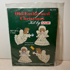 an old fashioned christmas gift bag with three angel dolls on it's front and back