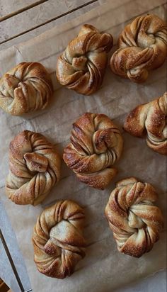 freshly baked pastries sitting on top of a piece of wax paper