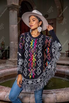 This gorgeous Mexican Artisanal Poncho is perfect for the cold months ahead! The multicolor Ethnic design adds that perfect pop of color and style to your wardrobe. This poncho is knit, has open sides and it comes in one size so anyone ranging from size Small to Extra Large will be able to wear it. Purchase the Mexican Hat and Filigree Earrings modeled Filigree Earrings: https://www.etsy.com/es/listing/884724796/filigrana-chapa-de-oro-filigrana-clasica?ref=listings_manager_grid Mexican Hat: http Multicolor Long Sleeve Poncho For Beach, Multicolor Long Sleeve Poncho For The Beach, Traditional Long Sleeve Poncho, One Size, Traditional Long Sleeve Poncho One Size, Multicolor Shawl Poncho For Festival, Multicolor Poncho Shawl For Winter, Multicolor Cape Poncho For Winter, Bohemian Multicolor Shawl Cape, Multicolor One Size Poncho For Festivals