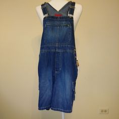 New With Tags 100% Cotton Dark Wash Indigo Denim. Shortall Overall With Adjustable Straps. Bib Overall Style With Cargo Pockets. Machine Wash Warm Approx. Measurements: Waist 16" Rise 11" Inseam 6" Style With Cargo, Denim Short Overalls, Cotton Overalls, Vintage Overalls, Short Overalls, Gloria Vanderbilt Jeans, Indigo Denim, Jean Overalls, Bib Overalls