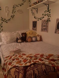 two teddy bears sitting on top of a bed