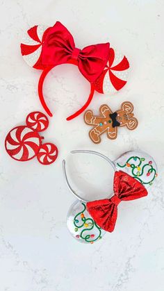 three christmas themed hair accessories on a white surface