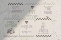 several parking signs on the side of a building with skulls and bones painted on them