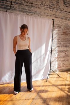 Our high waisted, versatile wide leg pant easily switches from a lazy Sunday to a busy day at the office. They are stretchy lounge pants that you wear to the office. Perfectly snatch the waist with a 2" waistband. Made of interlock knit cotton, these pants are extremely soft and stretchy. Always comfortable and the perfect length. You never have to tailor these pants. Material: 100% Organic Cotton Knit. This fabric is grown in Texas and milled in North Carolina. Fit: This is a soft and stretchy knit pant. We recommend that you stick with your normal size. Please reference our measurement guide to find your recommended waist and inseam sizes. Model: Karah wears a S waist and 30" length. Women's Business Casual, Business Casual Pants, Pants Custom, Knit Trousers, Black Wide Leg Pants, Womens Business Casual, Lazy Sunday, Wide Leg Pant, Knit Pants