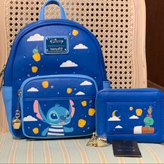 Boxlunch Exclusives X Loungefly X Disney X Lilo & Stitch Lantern With Scrump At The Spa Mini Backpack, Zip-Up Wallet & Enamel Pin! 3 Pc. Set Includes: Faux Leather Mini Backpack Features Gorgeous Fabric Lining, Enamel Brand Badge & Gold Lantern Charm On Zipper Pull! Beautiful, Shiny Gold Foil Debossed Stars Seem To Twinkle In The Night Sky!! & Scrump Is Catching A Ride On A Lantern! Faux Leather Wallet Features Matching Lining, Brand Plaque & Charm. It Has An Exterior Snap Pocket, With The Rest Stitch Loungefly Bag, Loungefly Disney Stitch, Lilo And Stitch Loungefly, Blue Disney Bag With Zipper Closure, Lounge Fly Disney Wallet, Stitch Backpack, Lilo And Stitch Drawings, Gold Lanterns, Loungefly Disney