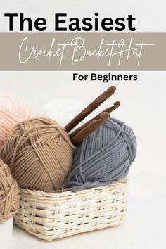 yarn and knitting needles in a basket with the words, the easier crafty bucket for beginners