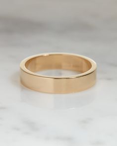 Band Details: ✧ Metal: Gold ✧ Metal Purity: 10K | 14K | 18K ✧ Metal Tone: Yellow | Rose | White ✧ Band Width: 4.0 mm We offer free engraving on all our engagement rings and wedding bands. And by this we go one step ahead in expression of love. Please contact us after your purchase with the engraving that you wish to add on the ring. Simple Band Rings Women, Flat Gold Ring, Wedding Bands For Women With Engagement, Wedding Band His, Wedding Band For Men, Gold Wedding Bands Women, Band Ideas, Bridal Flats, Ring Pop