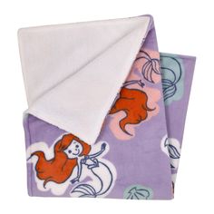 the little mermaid blanket is purple and has an orange mermaid on it's back