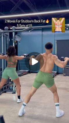 two people in green shorts and white socks are doing exercises at the gym with each other