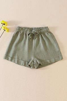 Get ready for some serious sage style with these linen girl shorts! Perfect for a day of fun in the sun, these shorts are made from soft and breathable linen fabric for a comfortable and stylish fit. Say goodbye to boring shorts and hello to the perfect addition to your summer wardrobe. (Oh, and did we mention they have pockets? Your mini fashionista will love them!) linen 300121 Trendy Solid Color Summer Shorts, Solid Color Shorts For Beach In Spring, Khaki Beach Shorts For Summer, Solid Color Summer Shorts, Summer Cotton Shorts In Solid Color, Khaki Shorts For Summer Vacation, Solid Cotton Beach Shorts, Solid Color Shorts For Spring Vacation, Trendy Linen Short Bottoms