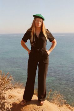 The California Shake Jumpsuit in Black – Miracle Eye Trendy Short Sleeve Jumpsuits And Rompers For Work, Trendy Short Sleeve Jumpsuits For Work, Chic Belted Jumpsuits And Rompers With Short Sleeves, Chic Belted Jumpsuit With Short Sleeves, Chic Belted Short Sleeve Jumpsuits And Rompers, Trendy Black Short Sleeve Jumpsuits And Rompers, Chic Belted Short Sleeve Jumpsuit, Retro Summer Jumpsuits And Rompers For Work, Retro Summer Workwear Jumpsuits And Rompers