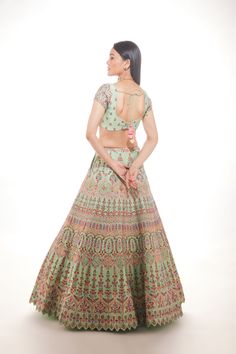 Green silk lehenga with intricate multi-hued Resham embroidery with a touch of sequins and glass beads paired with a matching blouse and mauve pink net dupatta From Chamee and Palak 's The Wedding Edit collection DELIVERY TIMEPlease allow 8-12 weeks for your outfit to arrive. FABRIC DETAILSSilk And Net Professional cleaning only. Pista Green Raw Silk Choli With Intricate Embroidery, Silk Embroidered Lehenga For Party Wear, Embroidered Silk Lehenga For Party, Party Wear Embroidered Lehenga In Raw Silk, Silk Embroidered Choli For Party Wear, Silk Embroidered Party Wear Choli, Pista Green Silk Lehenga With Intricate Embroidery, Silk Choli With Intricate Embroidery For Party, Embellished Lehenga With Saree Shape And Multicolor Embroidery