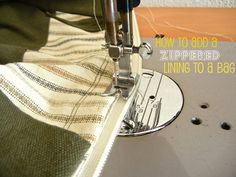 the sewing machine is stitching fabric on the side of a piece of cloth that has been sewn