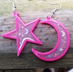 Crescent moon and star mismatched Neon pink holographic Glitter 3D printed resin earrings Lightweight Free Shipping MTcoffinz Placement of stars and mini moons will vary, making your pair one of a kind. Colors will be as shown. Message me if you want to create a pair with custom colors. 3D printed here in my studio, these are surprisingly lightweight even though they are quite large. These are made with pla and resin printers, filled with glitter and laser cut shapes Each earring measures approx Pink Glitter Resin Jewelry, Rave Jewelry, Crescent Moon And Star, Pink Holographic, Mini Moon, Plastic Items, Moon And Star, Hair Decorations, Holographic Glitter