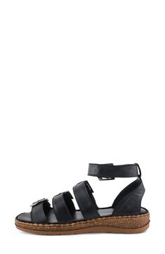 A cushioned footbed and shock-absorbing sole ensure daylong comfort in this supple leather sandal secured with adjustable buckle straps. 1 1/2" heel Adjustable ankle strap with buckle closure Cushioned footbed Leather upper and lining/synthetic sole Made in Turkey Modern Black Adjustable Sandals, Black Adjustable Sport Sandals With Leather Footbed, Leather Sport Sandals With Buckle Closure And Flat Heel, Adjustable Strapped Synthetic Sandals, Adjustable Closed Toe Leather Footbed Sandals, Black Strapped Adjustable Sandals, Adjustable Leather Closed Toe Footbed Sandals, Black Leather Sport Sandals With Strap, Black Leather Sport Sandals With Buckle Closure