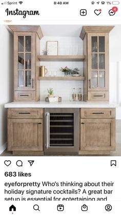 an instagramted photo of a kitchen with built in wine refrigerators and cabinets