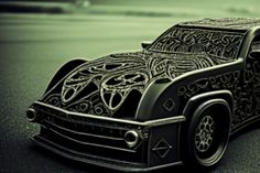 an intricately designed car is parked on the street