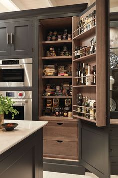 an open pantry in the middle of a kitchen