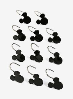 twelve pairs of mickey mouse earring hooks in black on a white background with clippings